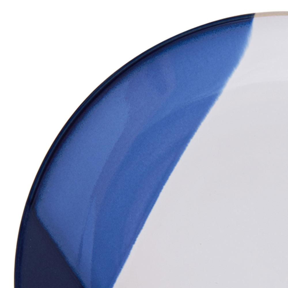 Close up of cobalt blue glaze along the rim of a Caden plate