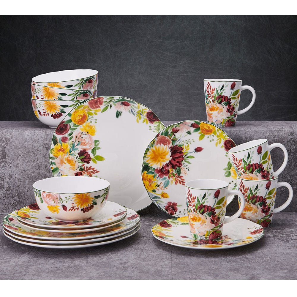 Clara floral 16 piece dinnerware set for four arranged with bowls cups and plates displaying the vibrant bloom pattern