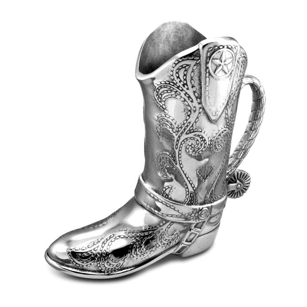 Silver cowboy boot pitcher with ornate western scrollwork and decorative handle.