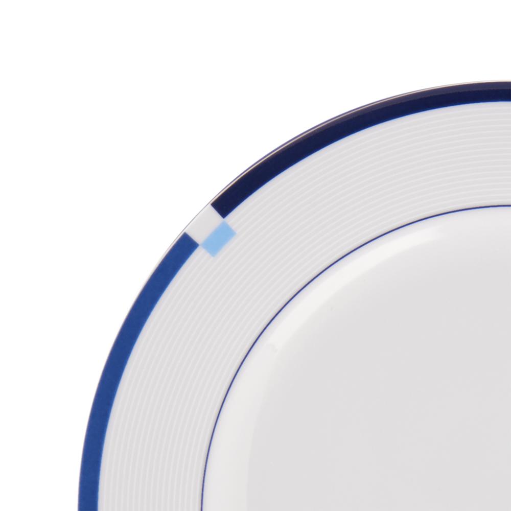 Close-up of Jet Set Blue salad plate rim with dark blue edge and light blue square accents.