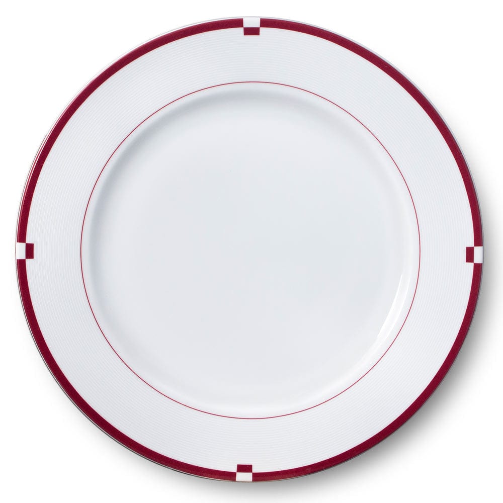Top-down view of a Jet Set Red dinner plate with white center, red rim, and square rim accents.