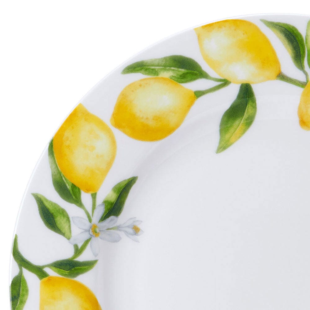 Close-up of lemon design along the rim of a ceramic plate
