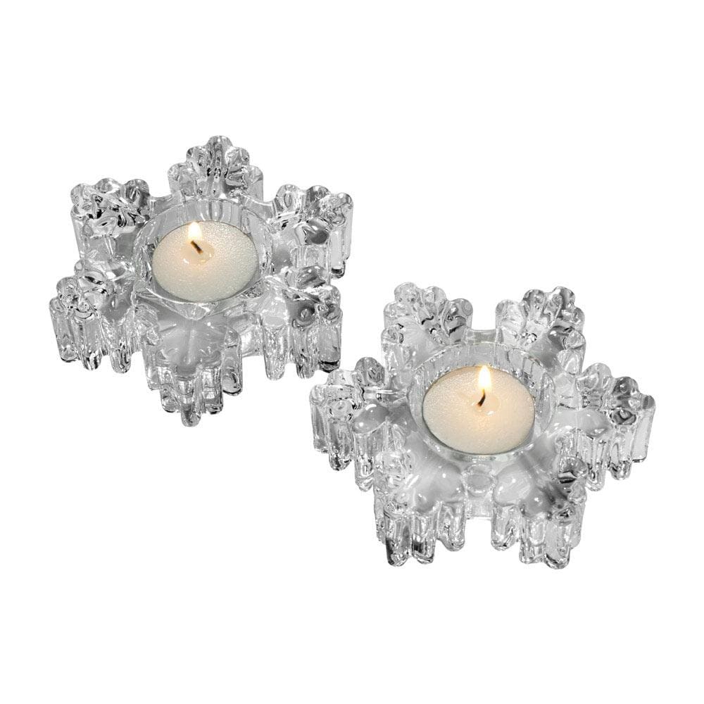 Pair of clear crystal snowflake tealight holders with lit tealights.