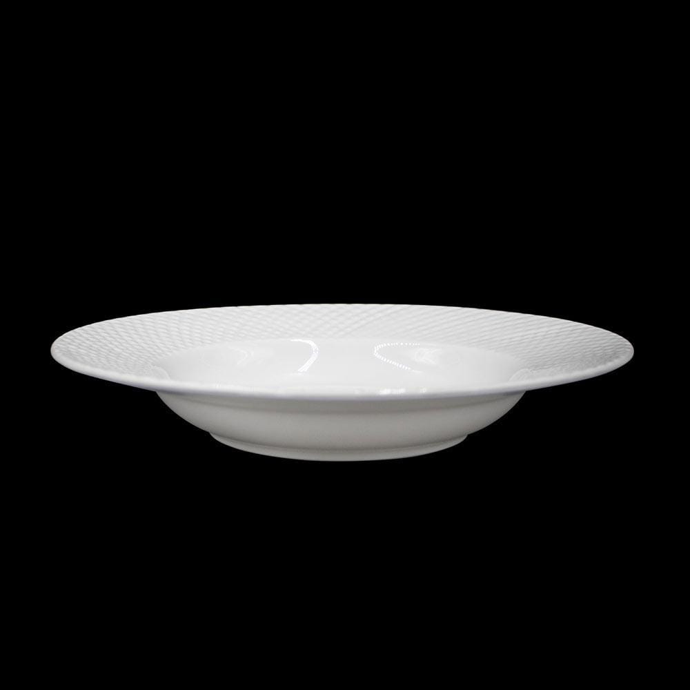 Side perspective of a white Stanton Rim Soup Bowl with textured rim against black background