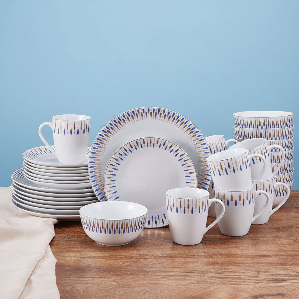 Starburst Blue 32 piece dinnerware set for eight displayed on a wooden table with plates bowls and mugs