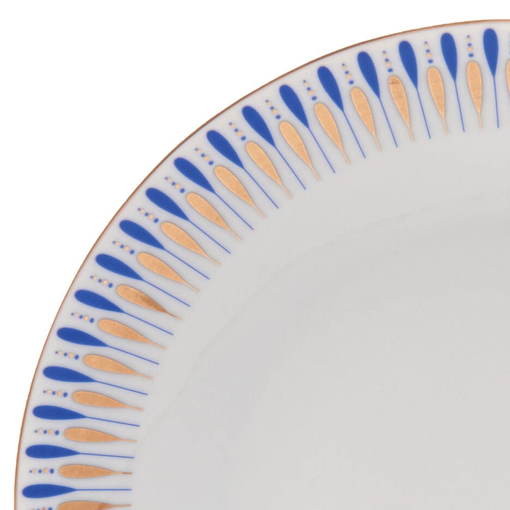Close-up of the Starburst Blue plate rim showing blue teardrop motifs with gold accents