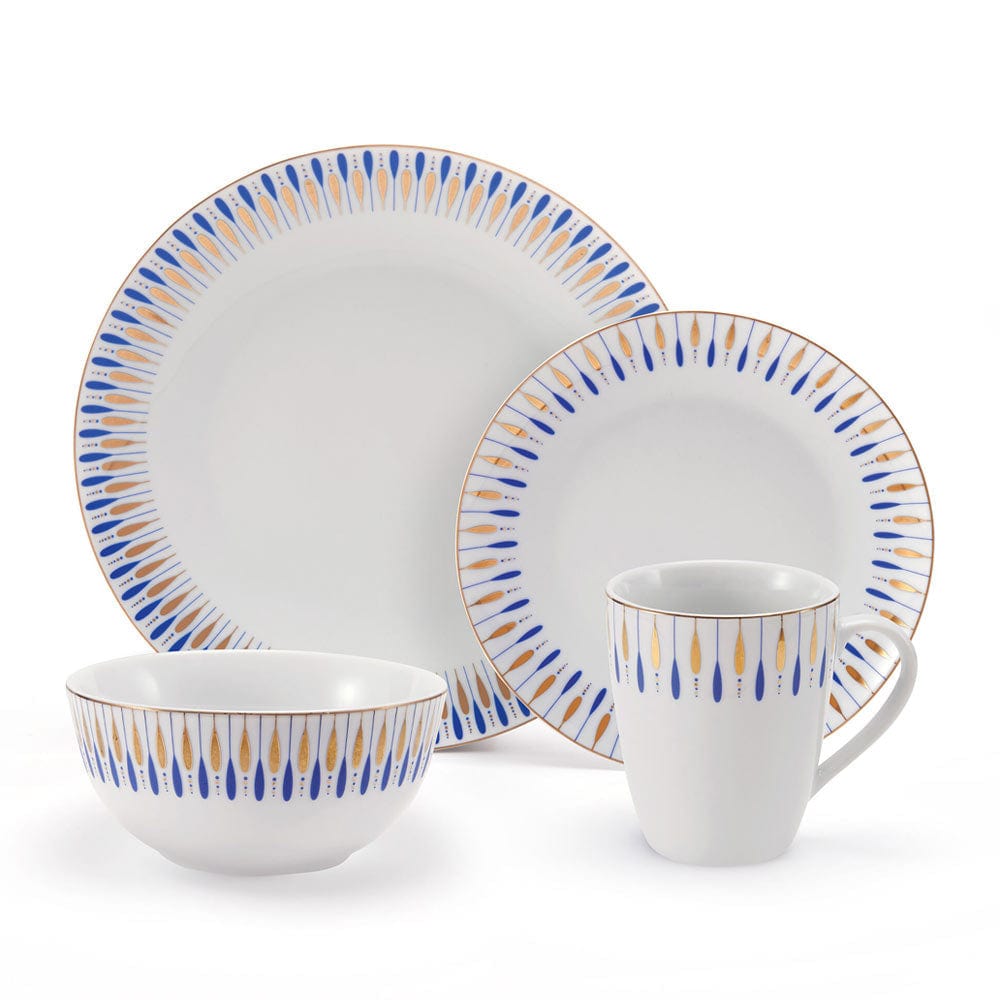 Starburst Blue dinnerware set with blue and gold teardrop rim pattern including plates bowls and a mug