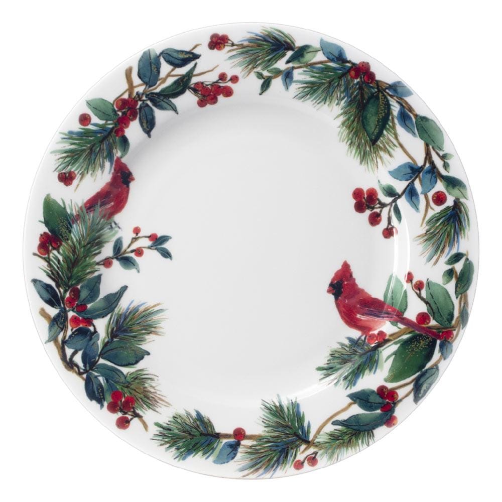 Top view of a Winter Cardinal dinner plate with a festive wreath of pine branches holly and berries around the rim.